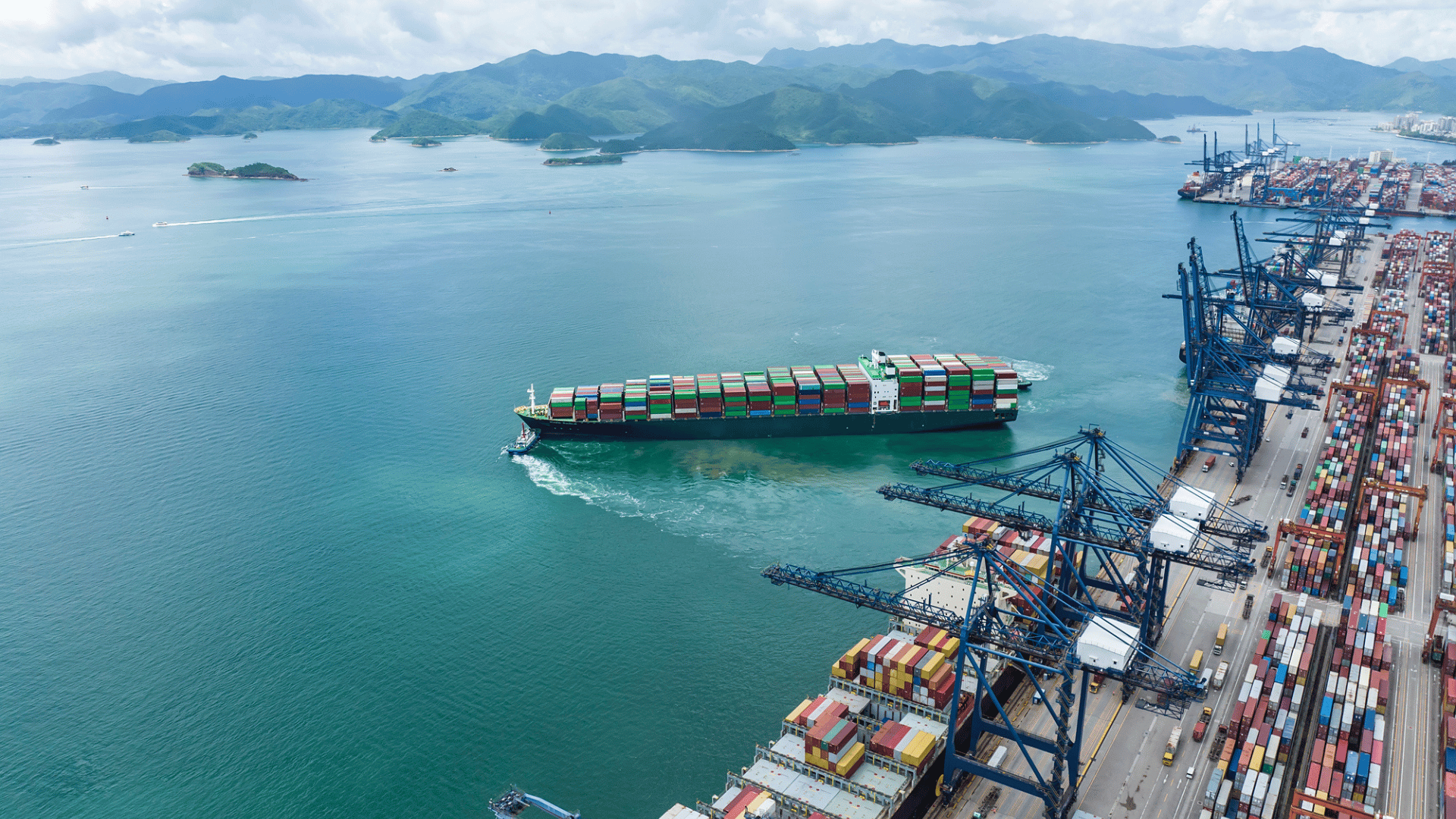 Container ship leaving shipping port