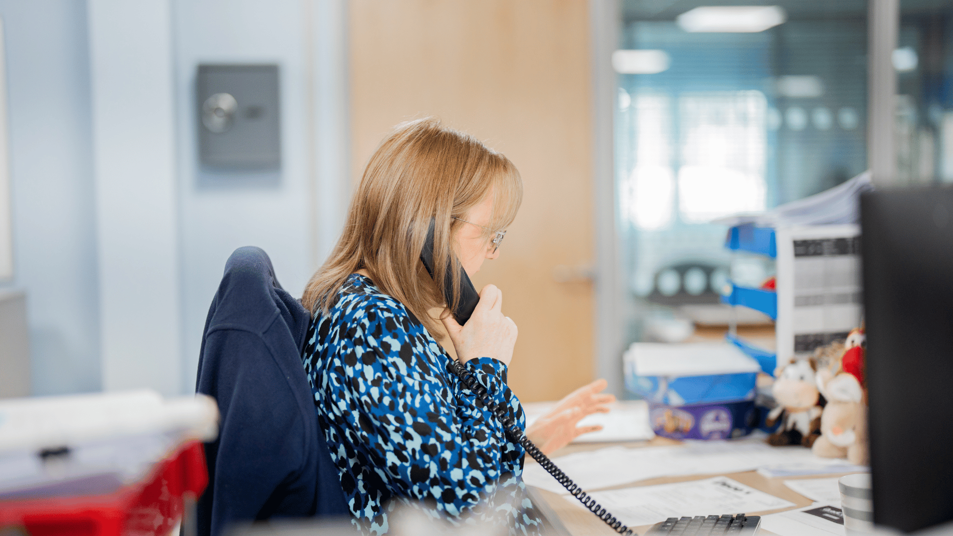 A Jenkar member of staff talking to a customer on the phone