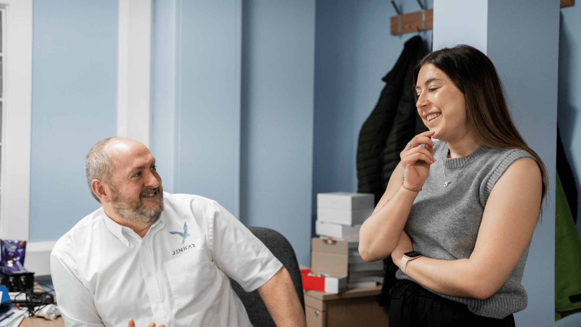 Two Members of Jenkar staff talking in the main office