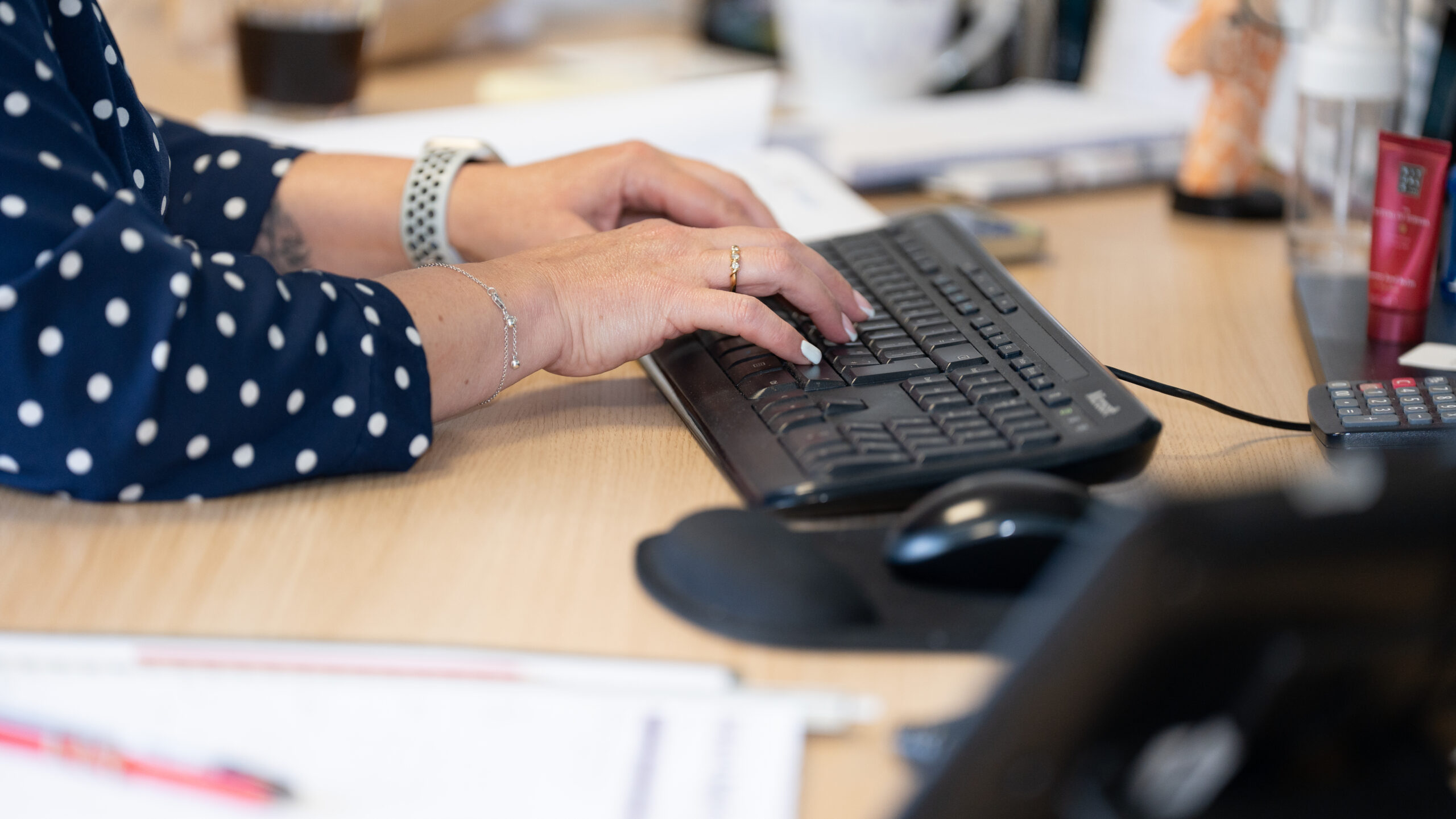 close up of someone typing on keyboard