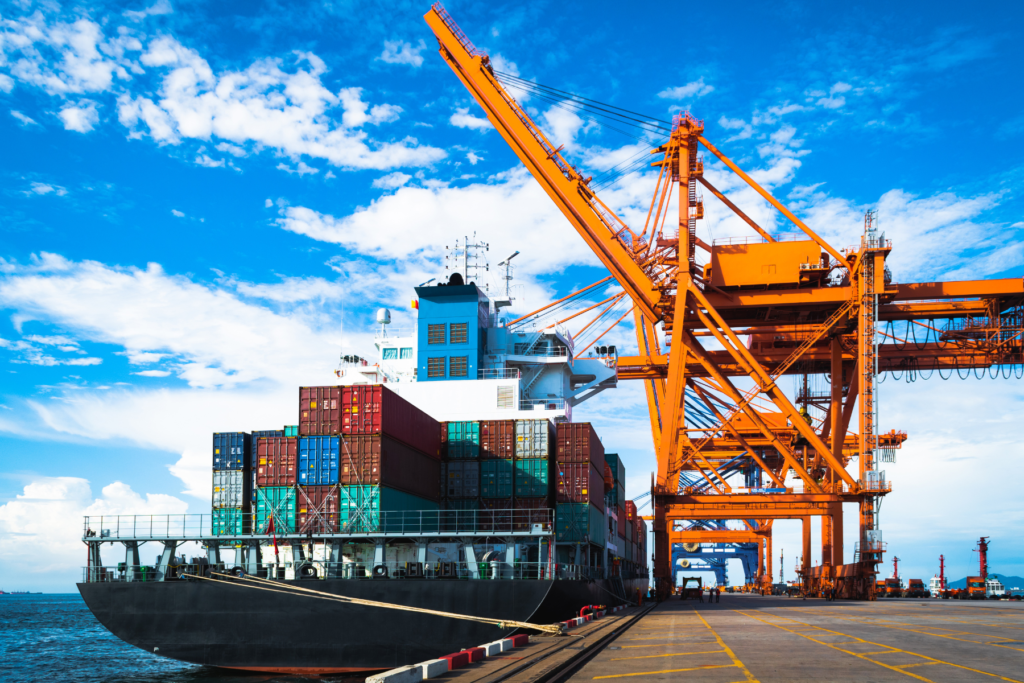 cargo ship loaded with containers, stationary at a shipping port