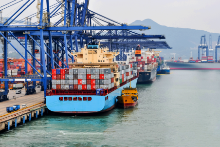 Cargo ship stationary at shipping port