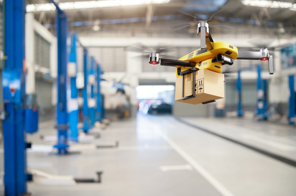 Flying delivery drone transferring parcel box in distribution warehouse 