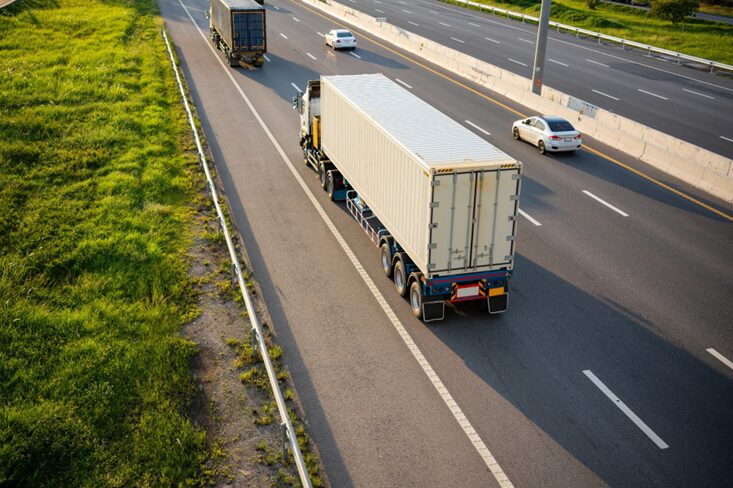 A freight truck transporting cargo along a motorway
